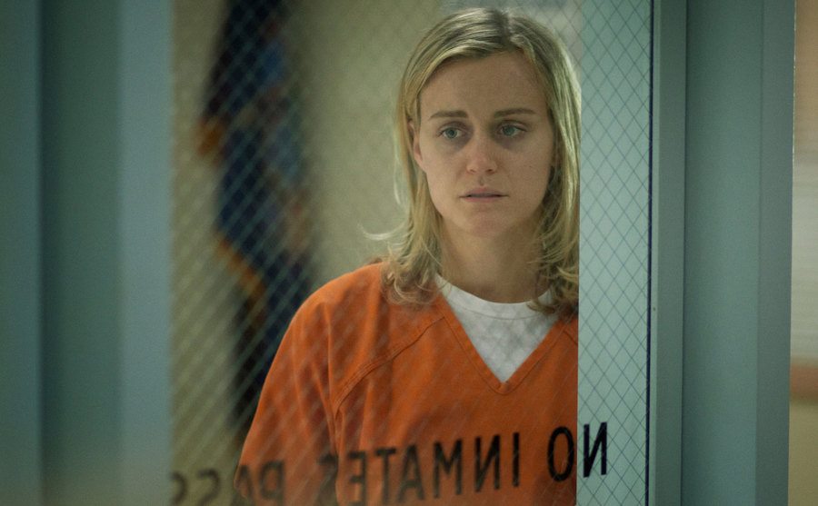 Taylor Schilling, as Piper Chapman, is locked up in prison.