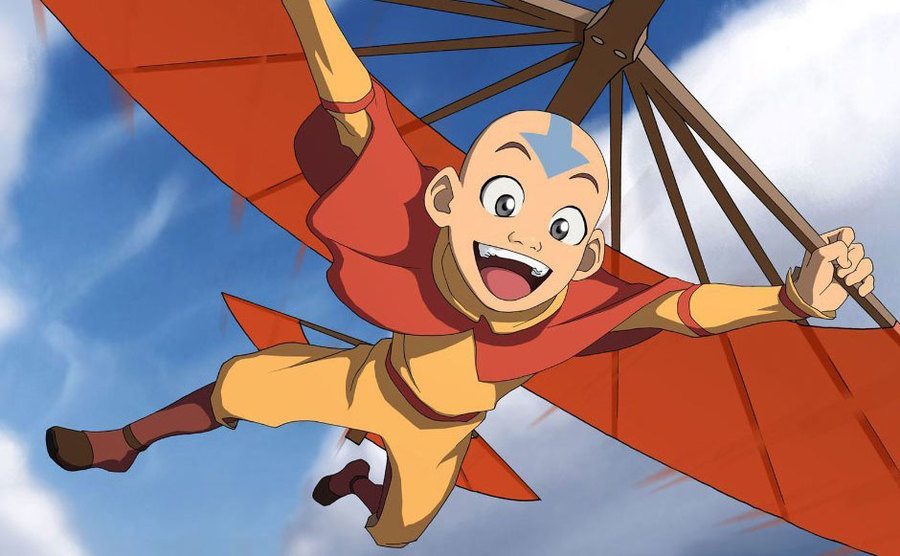 Avatar Aang flies through the air using his Airbender staff.