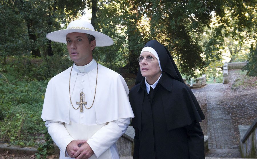 Jude Law and Diane Keaton walk through the Vatican gardens.