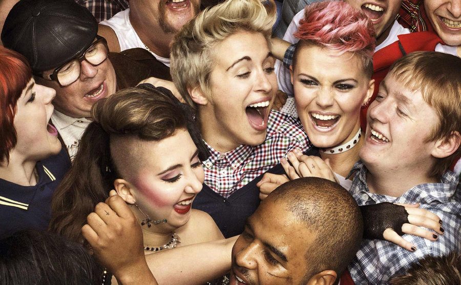 The cast of This is England 86, 88, and 90 falls all over each other in a group photo.