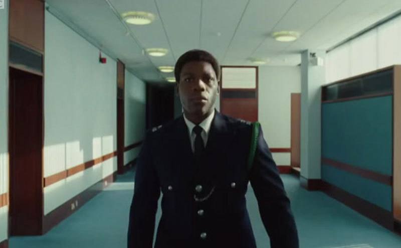 John Boyega walks down the halls in a scene from Small Axe.