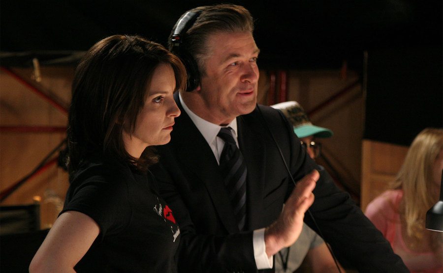 Tina Fey (Liz Lemon) and Alec Baldwin (Jack Donaghy) are on the set of 30 Rock.