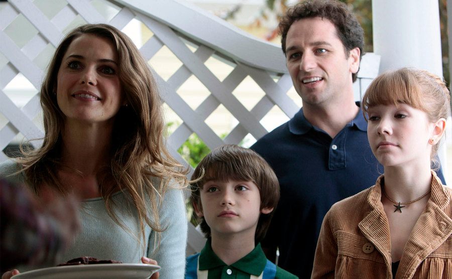 The Jennings family brings brownies to their neighbors.