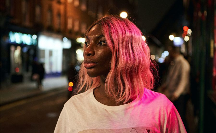 Michaela Coel, as Arabella Essiuedu, walks down the street.
