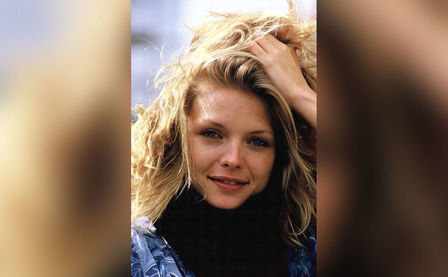 Michelle Pfeiffer poses on set.