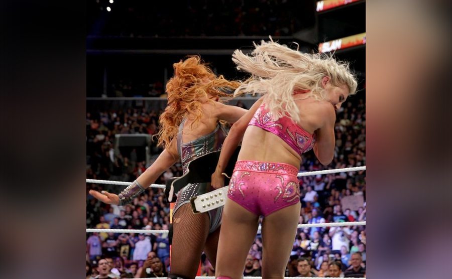Becky Lynch smacks Charlotte Flair in the ring.