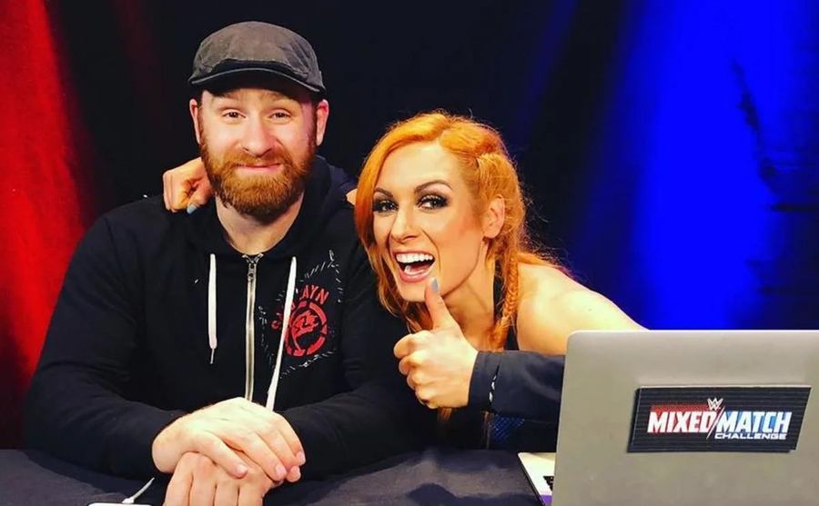 Sami Zayn and Becky Lynch take a photo together.