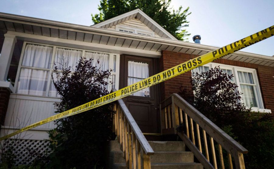 An image of police tape blocking the entrance to Adam’s house.