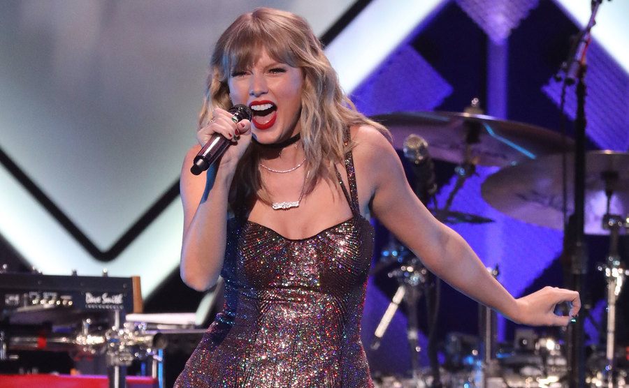 Taylor Swift performs on stage.