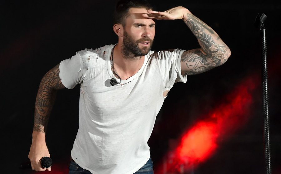 Adam Levine performs onstage.