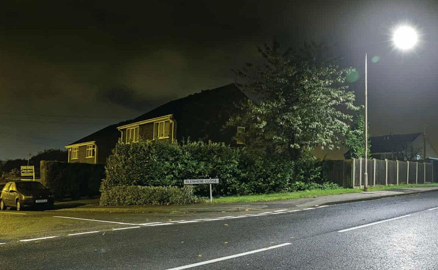 An exterior shot of the house at night.