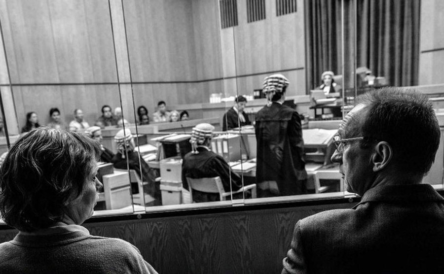A movie still from a scene in court.