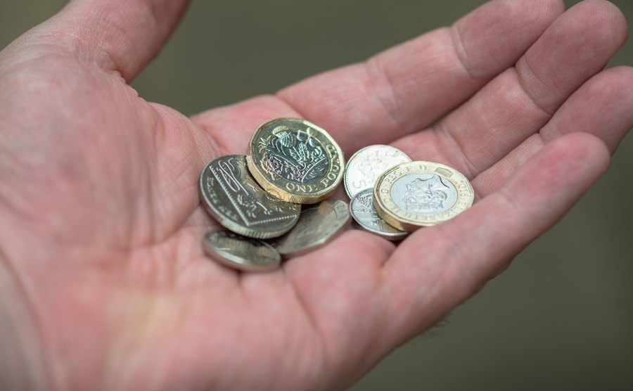 An image of coins in an open hand.