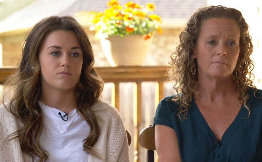 Emily and Laura speak during a televised interview.