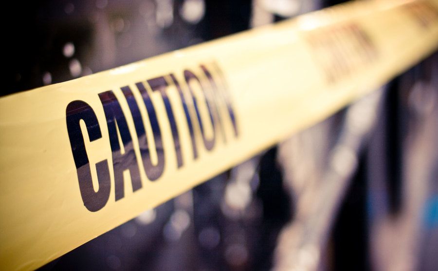 A yellow police tape that reads caution.
