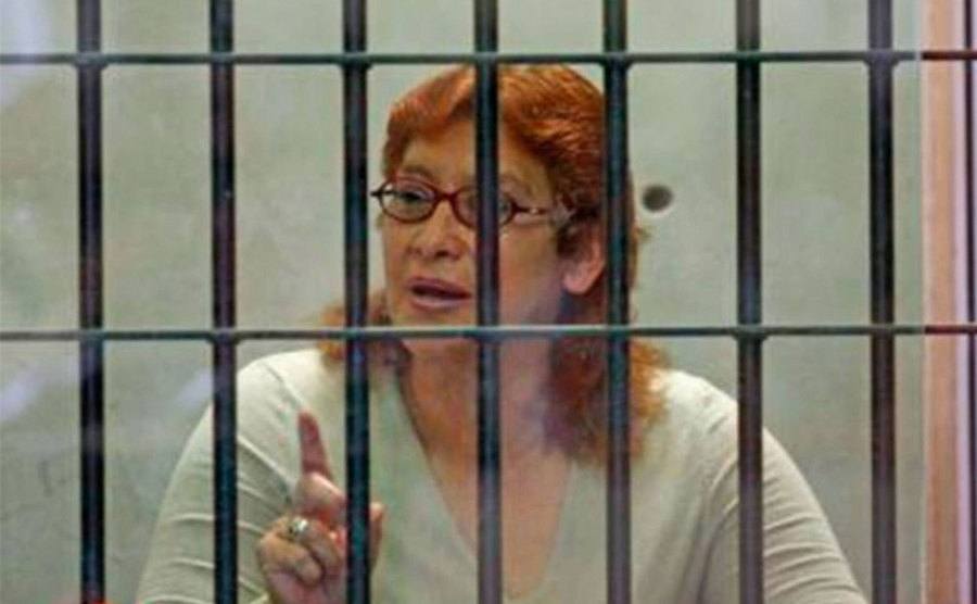 A photo of Juana Barraza sitting behind bars.