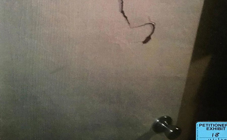 An image of a punched door.