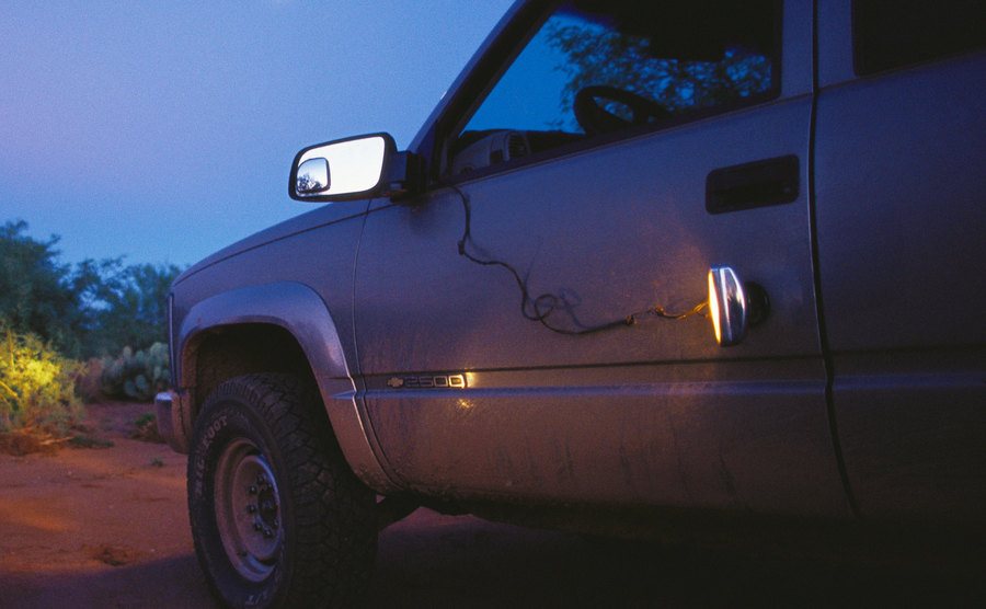 An image of an SUV at night.