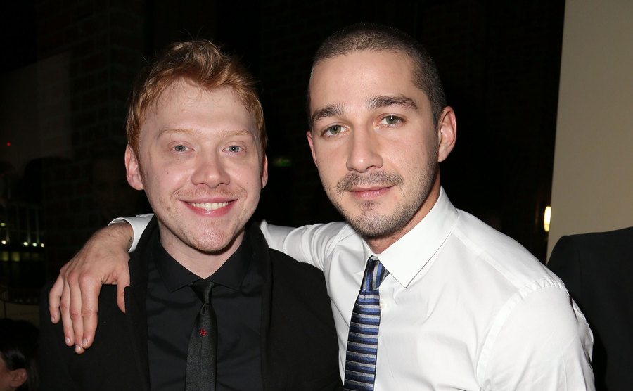 Rupert Grint and Shia LeBeouf attend an event. 