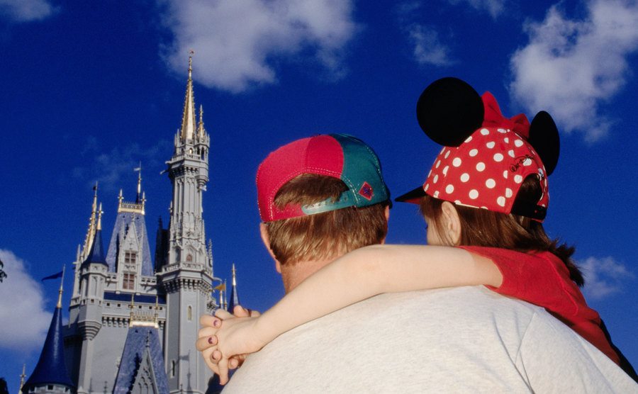 A picture of tourists viewing Cinderella’s Castle.