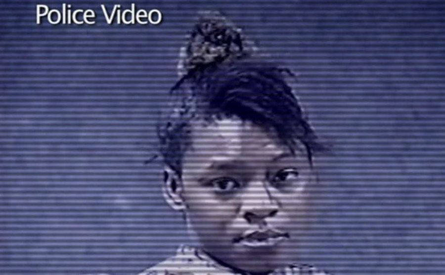 A portrait of a young girl in a police security tape.