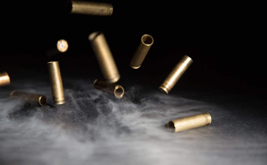 An image of smoking bullets falling on the ground.