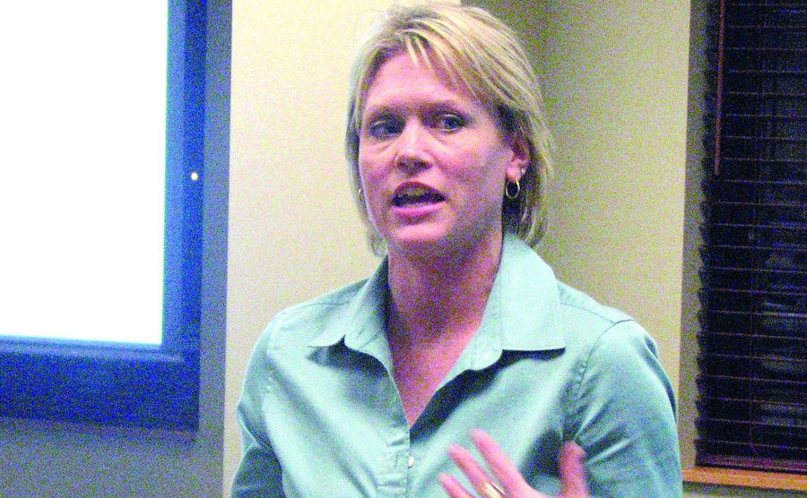 An image of Stacey answering questions during a lecture about her case.