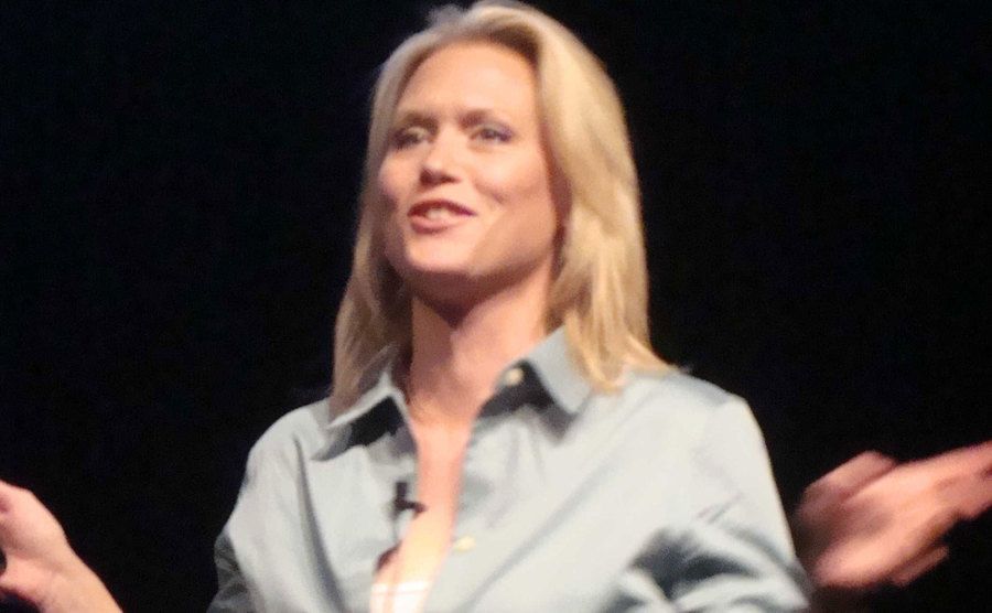 A picture of Stacey giving a lecture onstage.