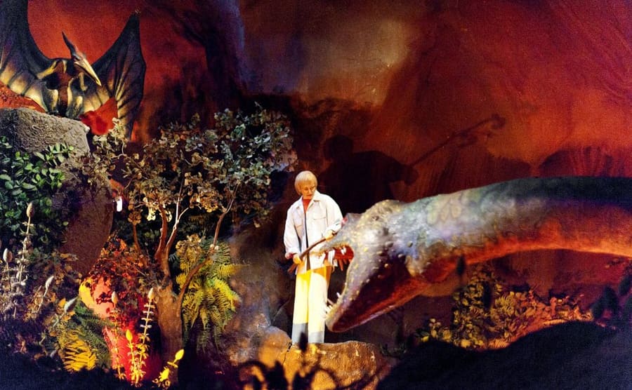 The Ellen’s Energy Adventure ride with the Ellen doll holding a stick in the direction of the dinosaur
