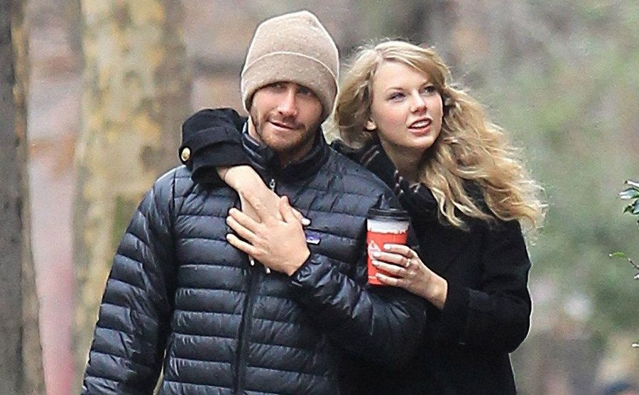 Taylor Swift has her arm around Jake Gyllenhaal while out on a walk.