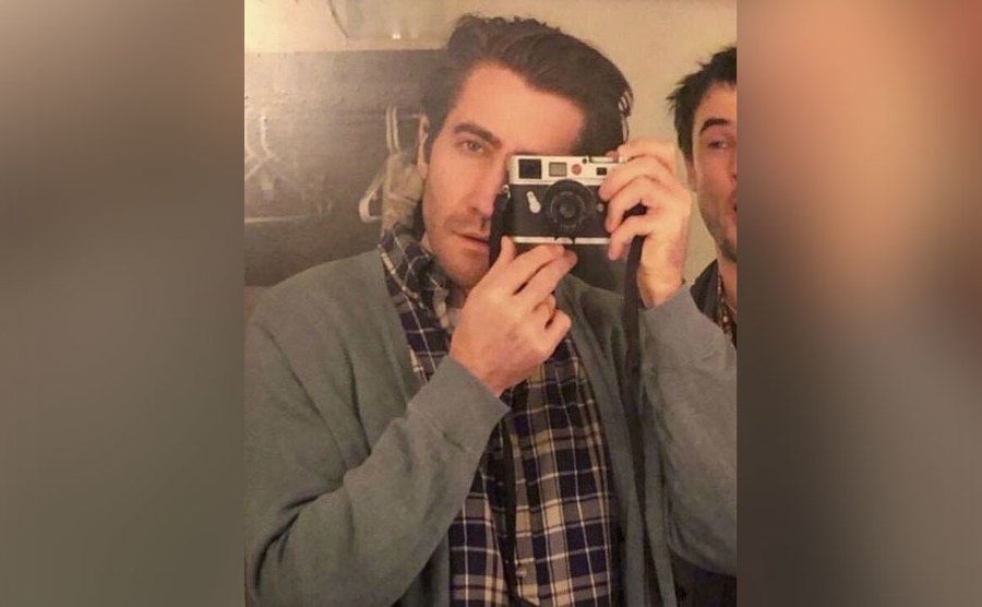 Gyllenhaal takes a picture of himself in the mirror.