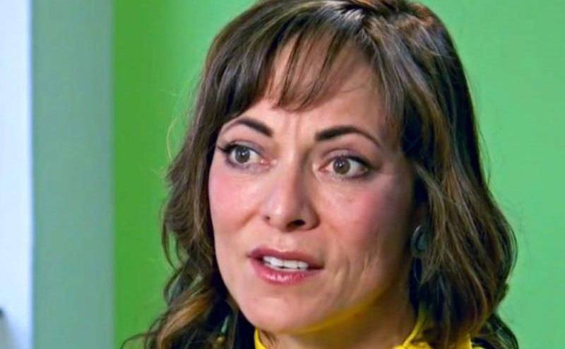 A woman speaks during an interview.