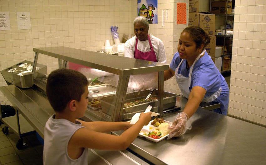 A photo of a kid at the school’s cafeteria.