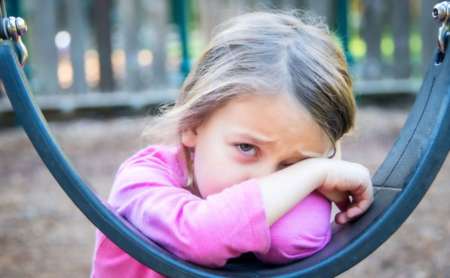 A little girl cries at the school’s playground.