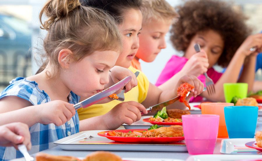 An image of kids enjoying their lunchtime.
