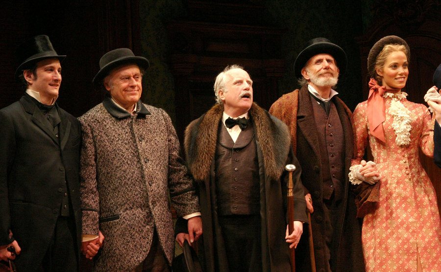 A picture of Bronson Pinchot, Bob Dishy, Richard Dreyfuss, Rene Auberjonois, and Elizabeth Berkley on stage.