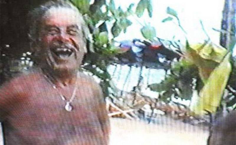 A video still of Josef smiling at the camera.