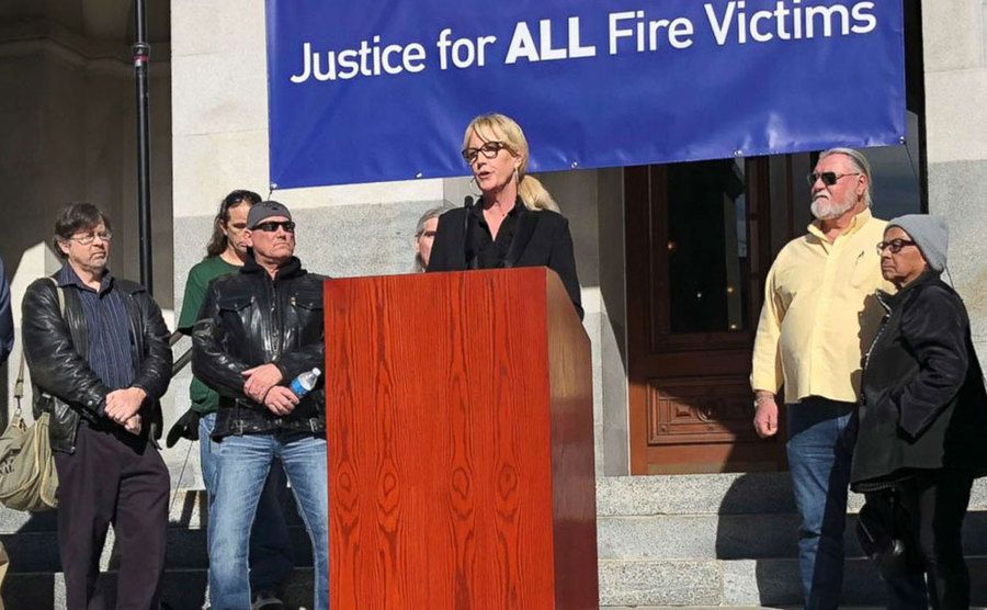 An image of Erin speaking to the media.