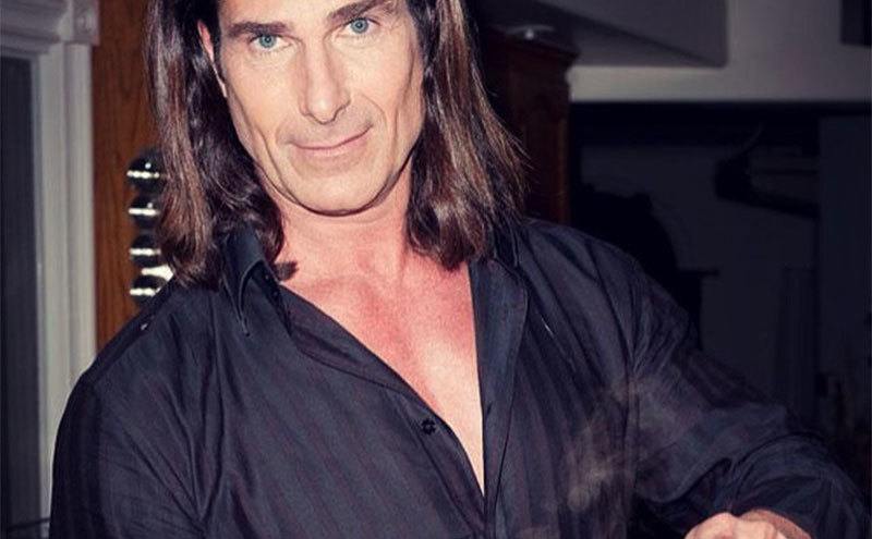 A portrait of Fabio pouring coffee.