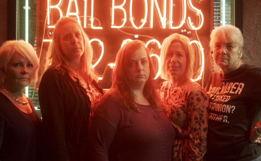 The deceived women pose in a promotional shot of the docuseries.