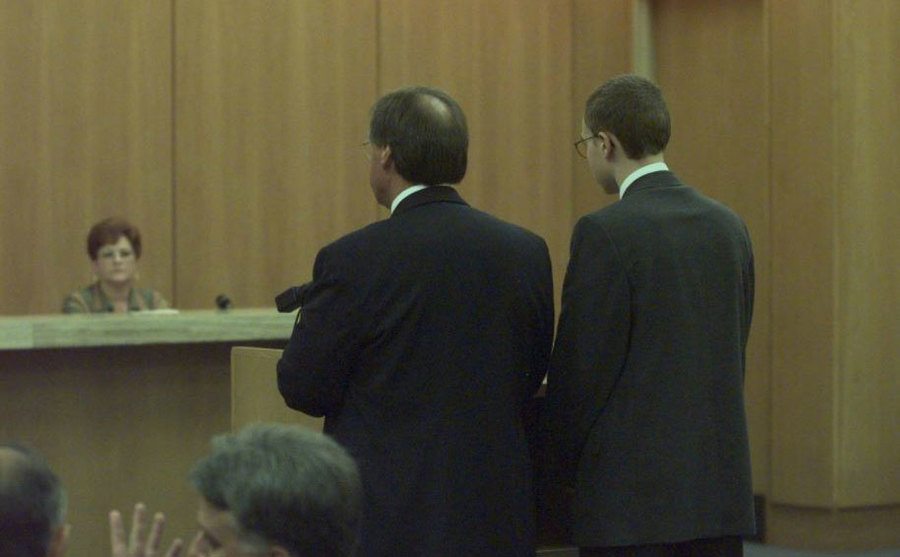 A photo of Josh Phillips standing in court. 