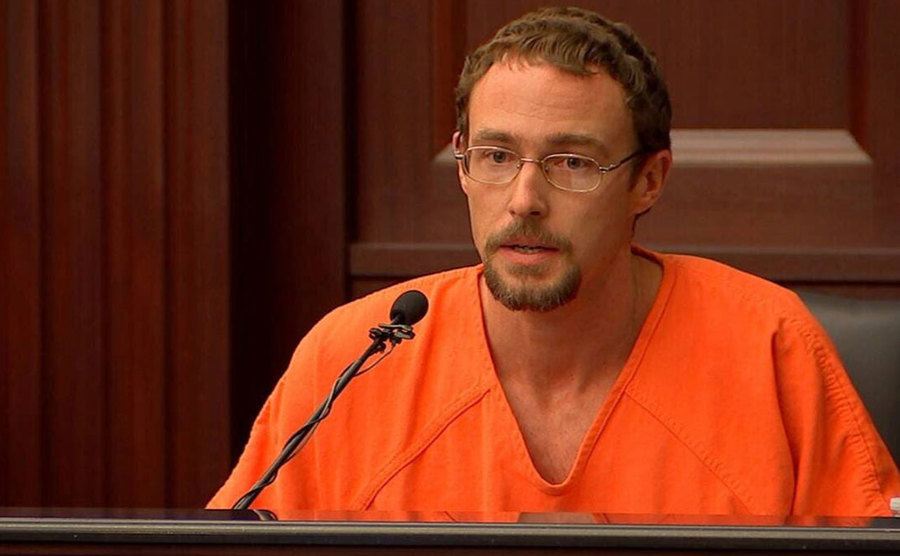 A still of Josh testifying in court.