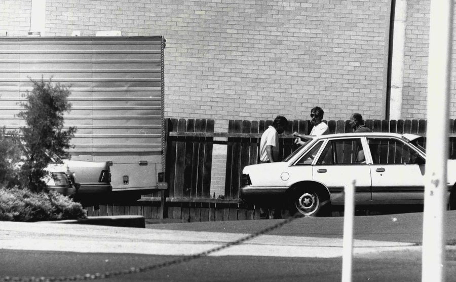 A picture of the police outside Pizza Hut.