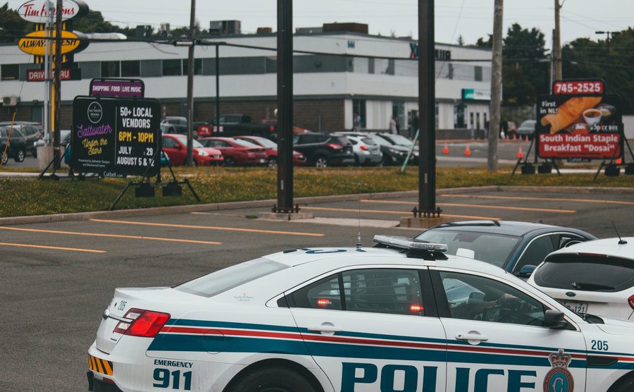 A photo of a police car parked in the street.