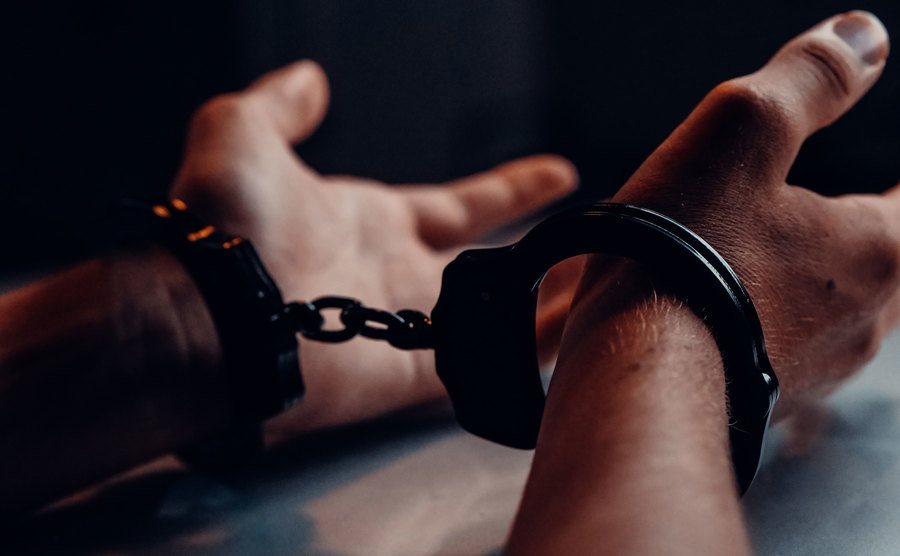 An image of hands in handcuffs.