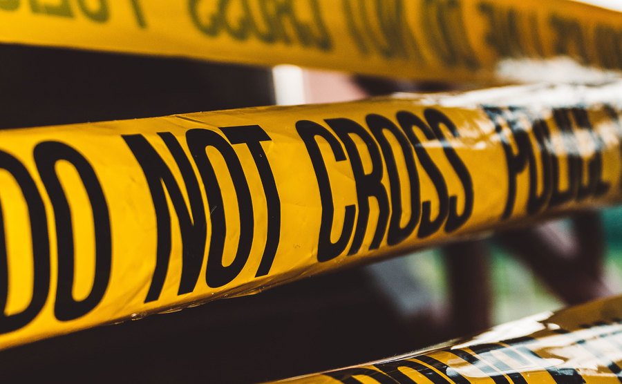 A photo of police tape at a crime scene.