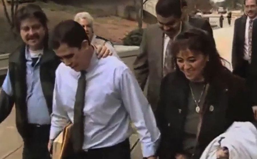 Ochoa walks home surrounded by his family and lawyer.