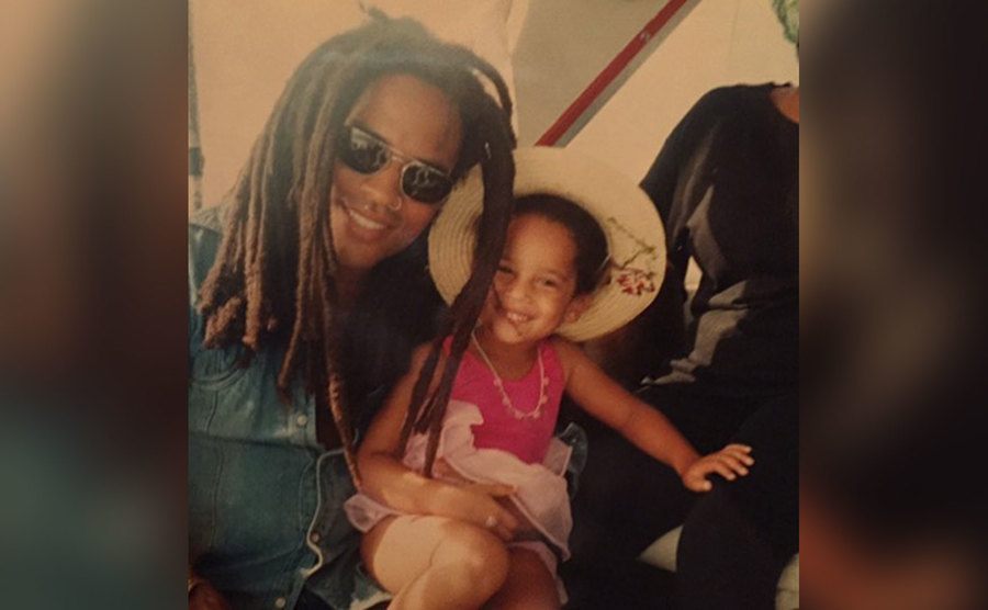 Lenny Kravitz holds his daughter Zoe in his arms. 