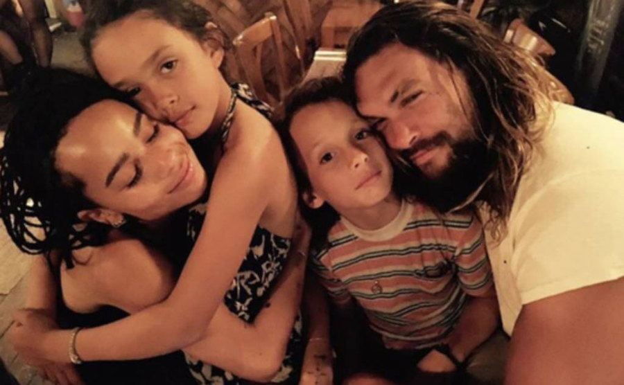 Lisa Bonet and Jason Moma embrace their children. 