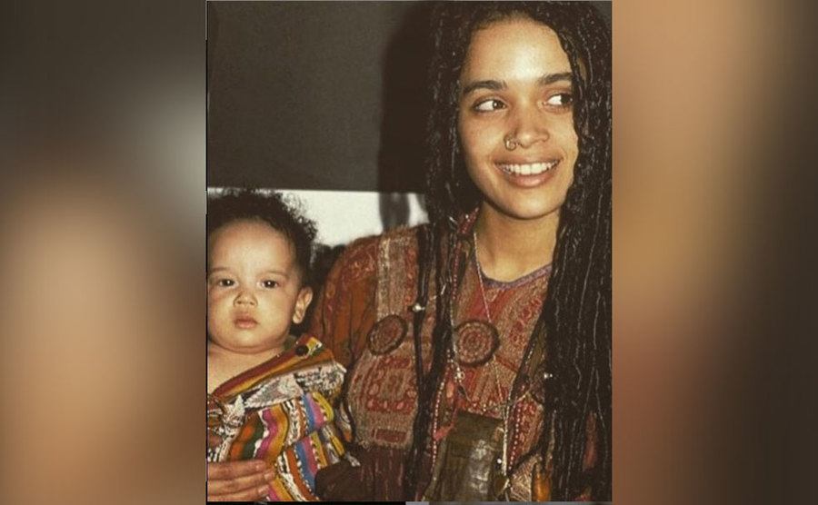 Lisa Bonet holds up a baby Zoe. 